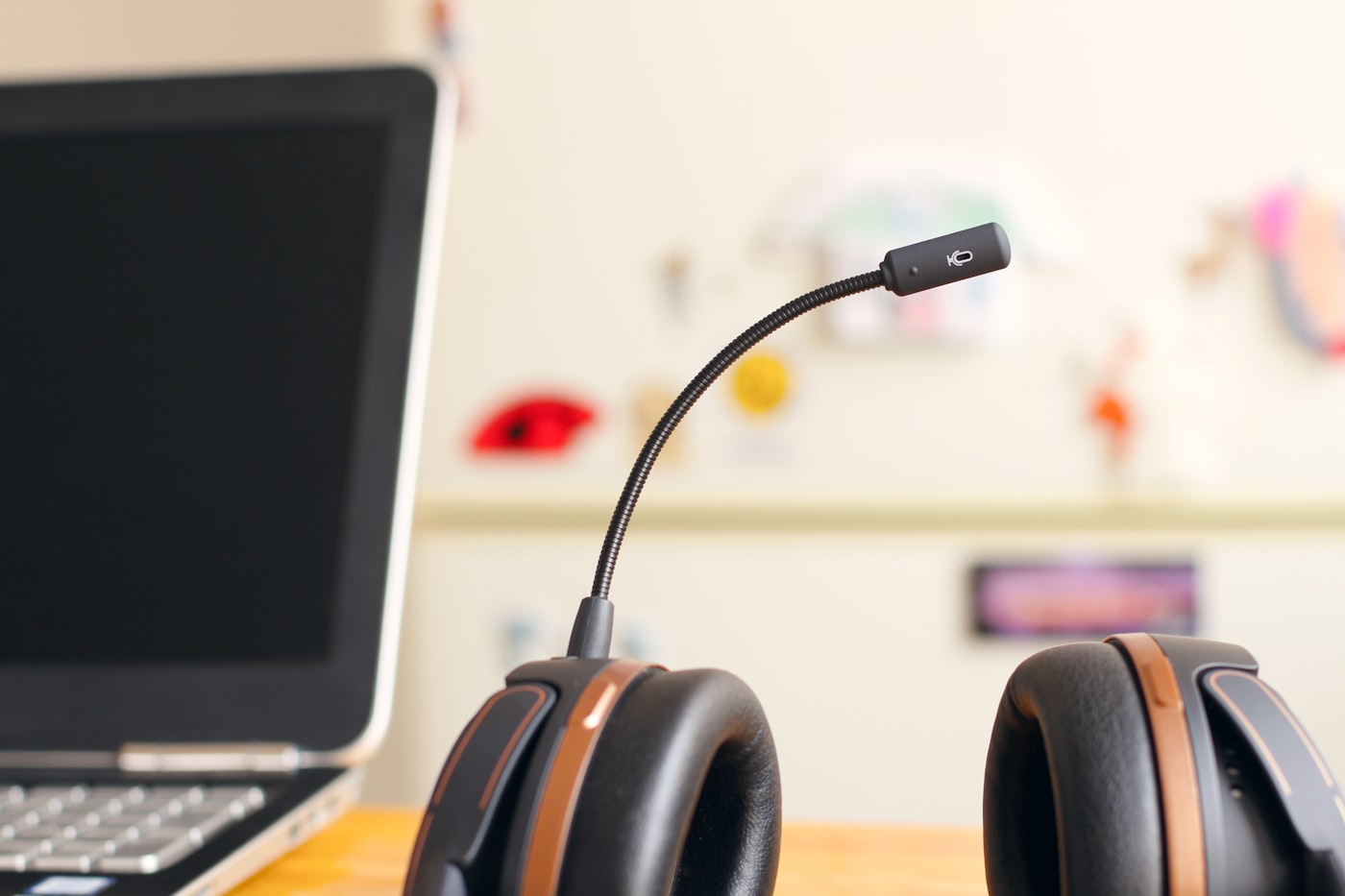 Headset and laptop on a dispatch desk lit by screen glow