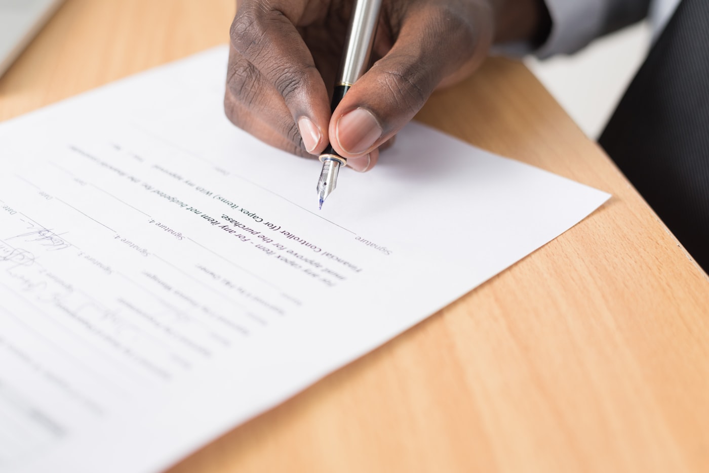 Hand writing notes on a document