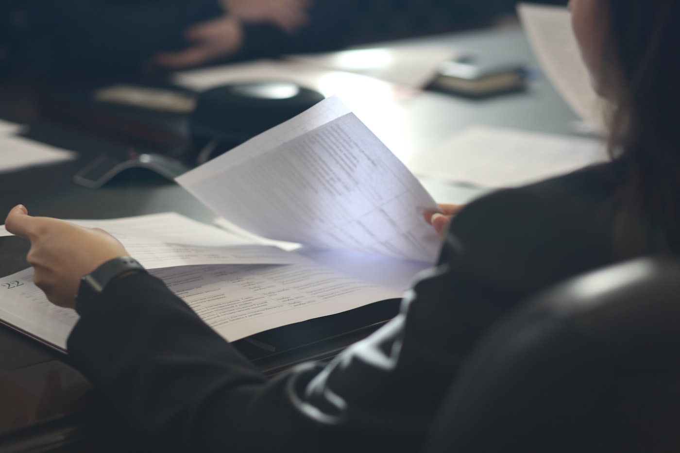 Linguist reading and reviewing a document